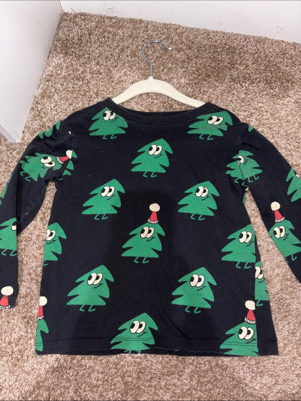 H&M Black Long-Sleeve Tee with Green Tree Motif and Red Hat Detail